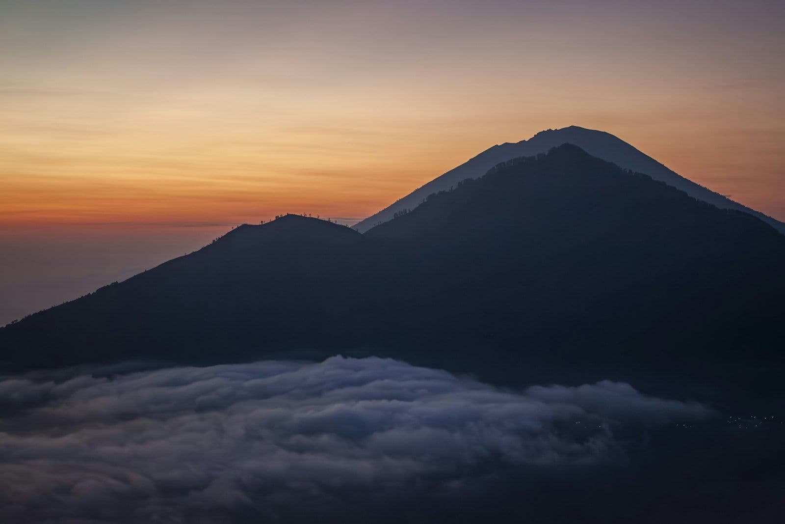 An active volcano climbed by headlamp before dawn, cold at the top and crowded in season