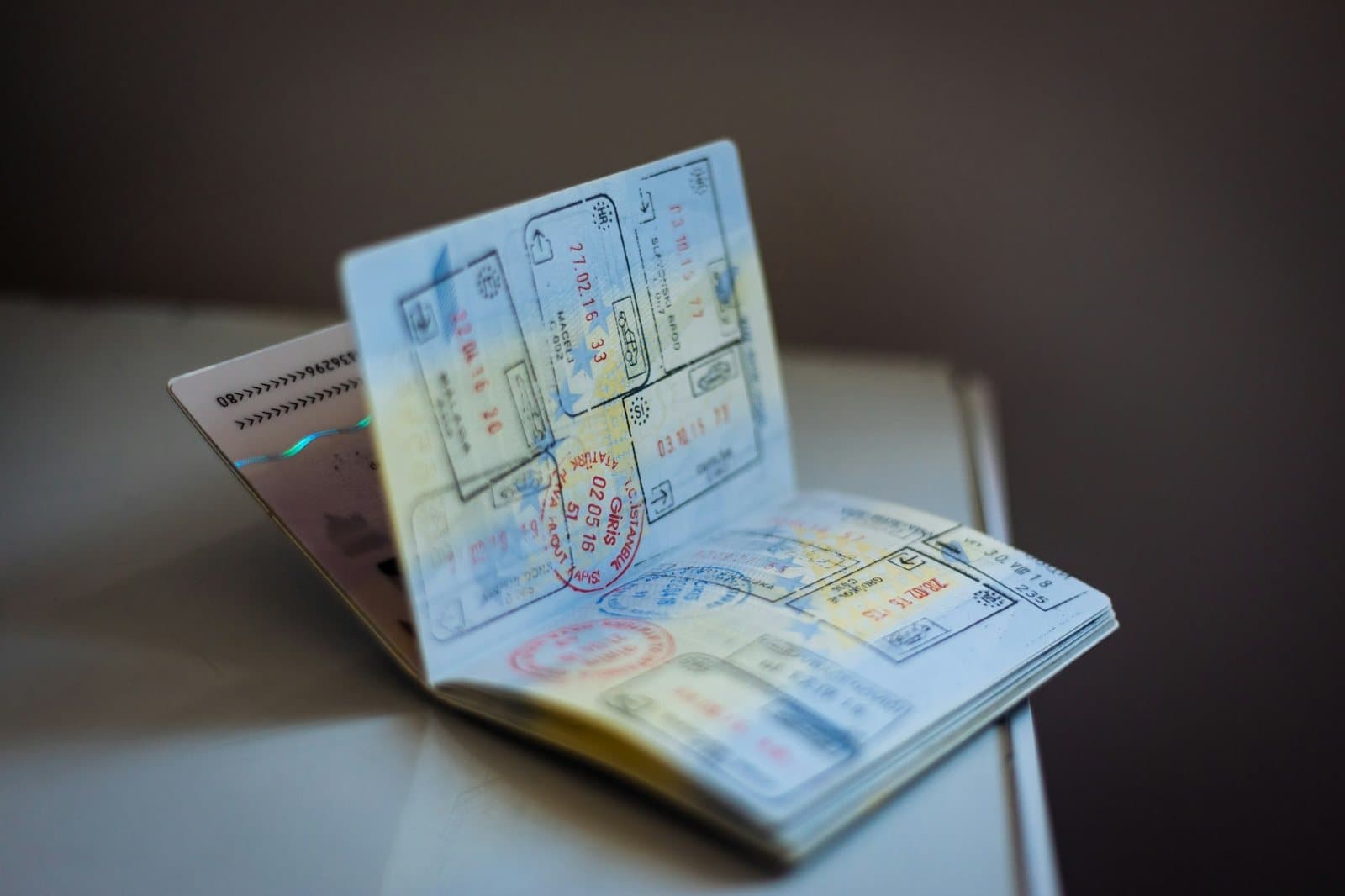 An open passport covered in entry and exit stamps